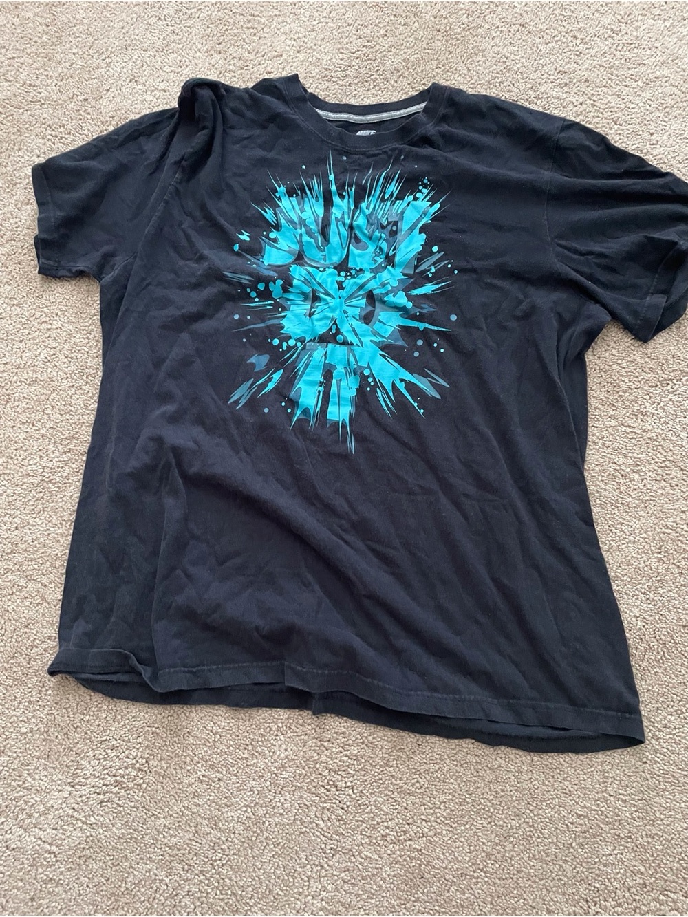 Nike Black Short‑Sleeve Tee with Bright Teal Burst Graphic